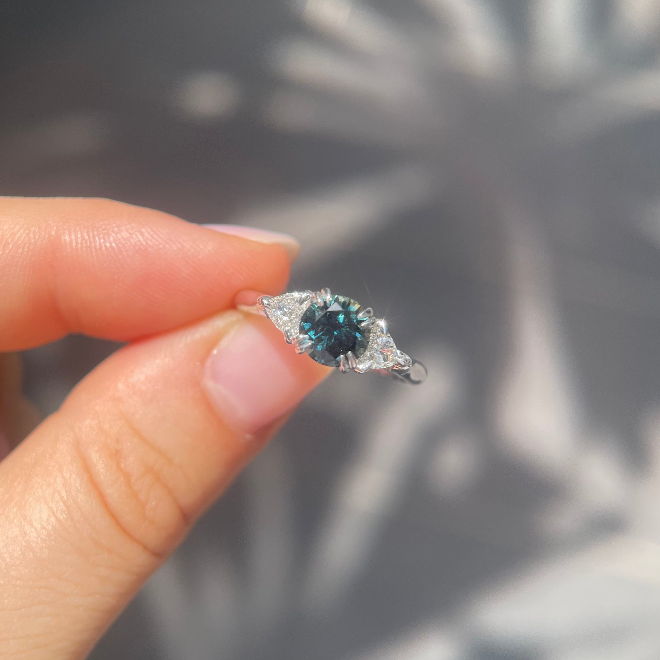 1.58ct sparkly teal sapphire and diamond trilogy