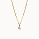 Gold and diamond necklace on a white background