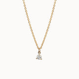 Gold and diamond necklace on a white background