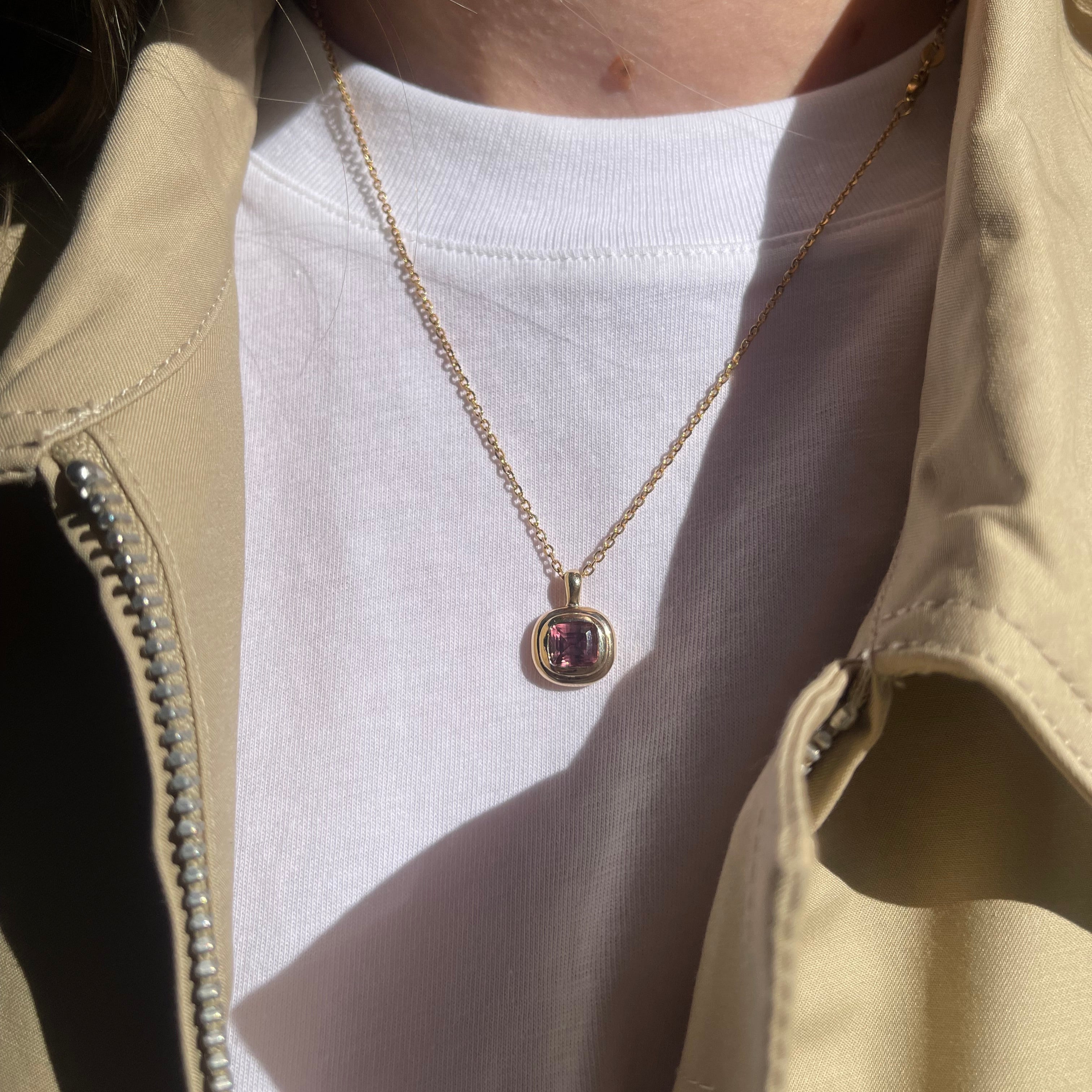 Pink necklace.